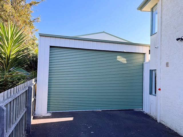 B&D wind-rated Roll-A-Door featuring a Windlocked System and Power Drive opener in a COLORBOND Pale Eucalypt finish, professionally installed in Lara by Ascent Garage Doors.