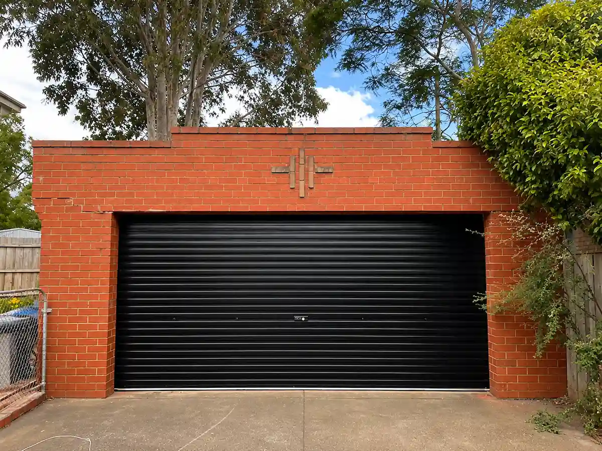 A premium Gliderol double roller garage door in a sleek COLORBOND Night Sky finish, professionally installed in Highton, Geelong by Ascent Garage Doors.